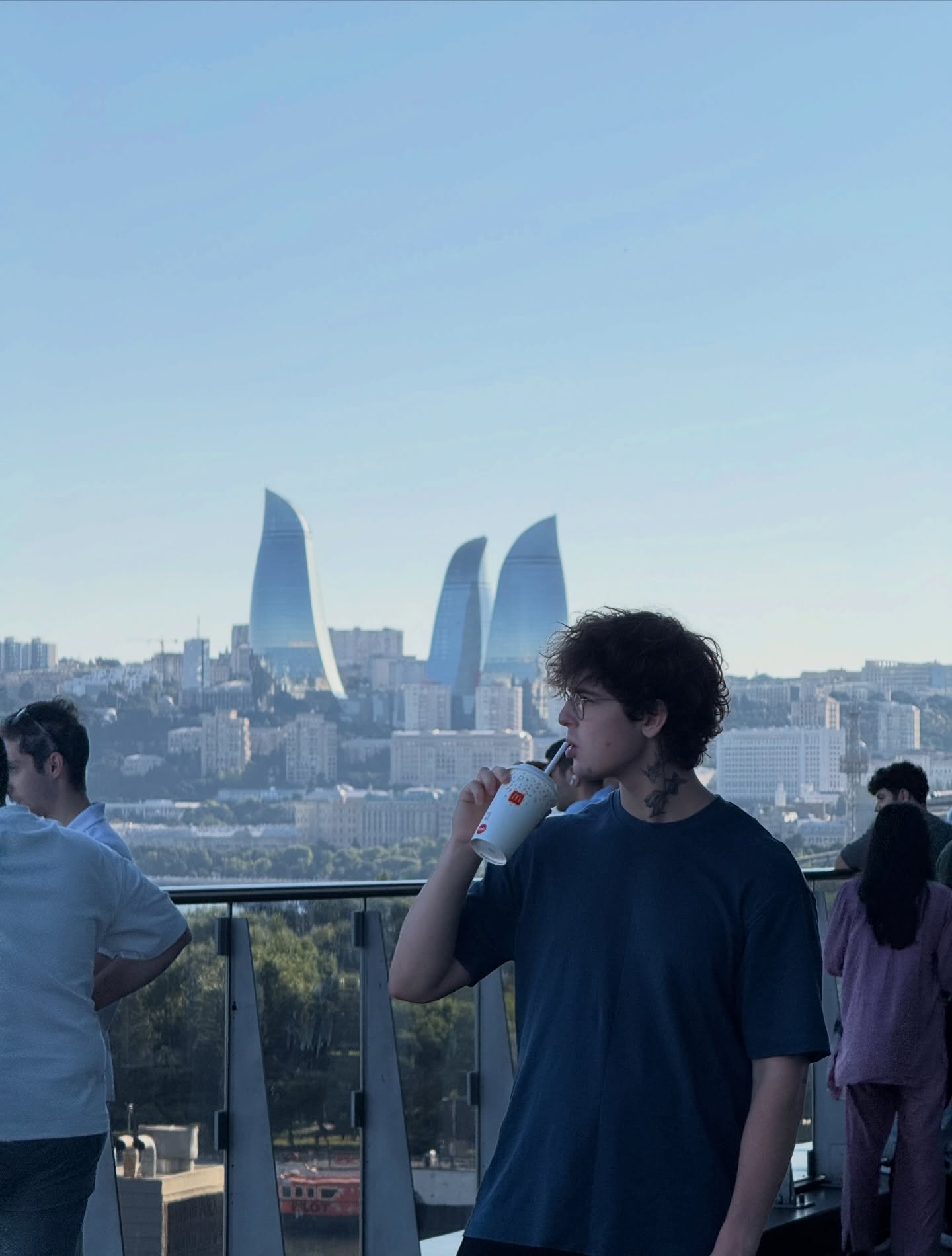 Looking out over Baku's Flame Towers skyline from a rooftop